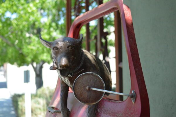 sculpture of dog in car window in paso robles