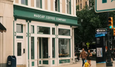 A couple walks past Madcap Coffee Company in downtown Grand Rapids, Michigan. in Grand Rapids Scavenger Hunt, MI