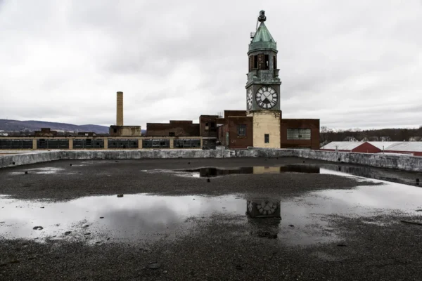 An Exterior View With Reflection Of The Clock Tower And Factory Of The Abandoned Scranton Lace Factory In Scranton, Pennsylvania. in Scranton Scavenger Hunt, PA