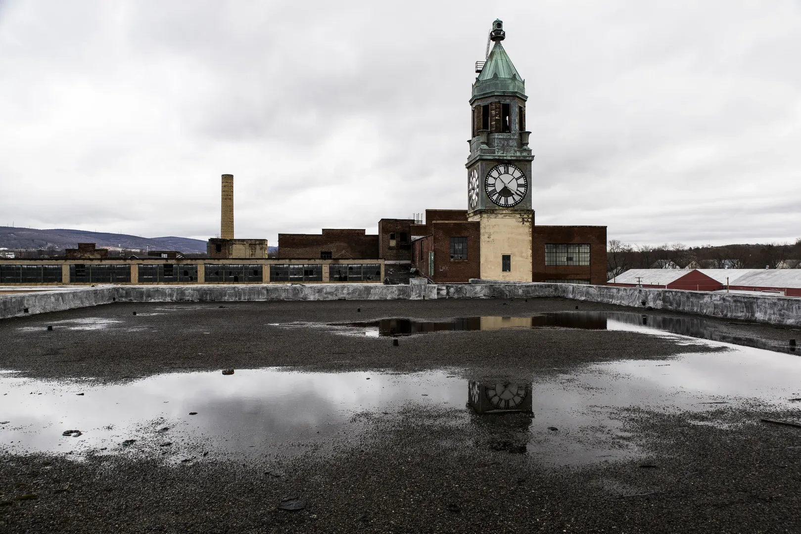 An Exterior View With Reflection Of The Clock Tower And Factory Of The Abandoned Scranton Lace Factory In Scranton, Pennsylvania. in Scranton Scavenger Hunt, PA