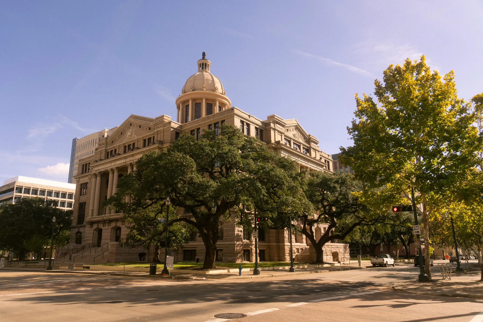 Stunning view of a historic courthouse building with trees, in downtown Houston, Texas. in Houston Scavenger Hunt