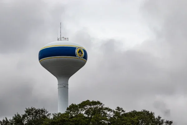 A tall water tower in Fernandina Beach, Florida stands against a dramatic cloudy sky. in Fernandina Beach Scavenger Hunt, FL