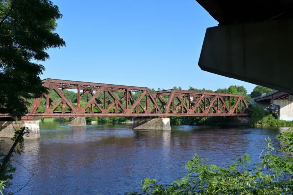 Nashua Subdivison railway bridge over Merrimack River in Hooksett, NH June 2026.jpg in Nashua Scavenger Hunt, NH