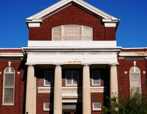a brick building with pillars in Cedar Rapids Scavenger Hunt, IA