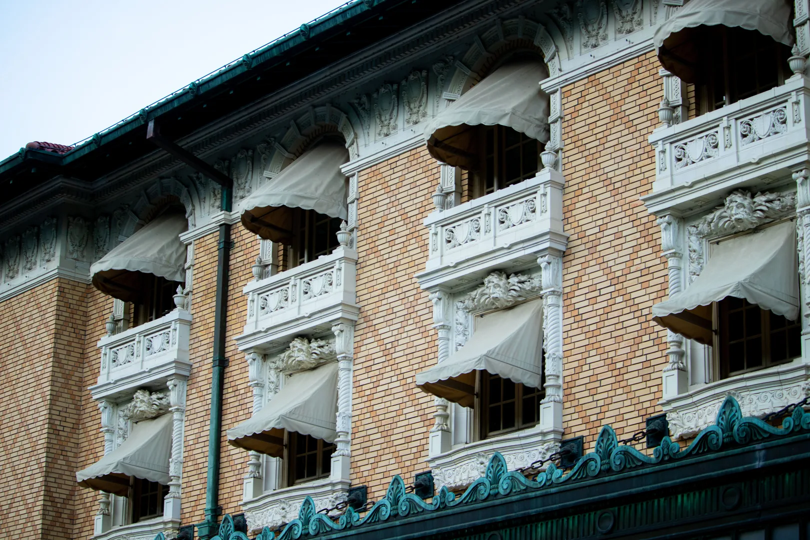 Elegant facade of a historic building on Bathhouse Row, showcasing intricate architectural details in Hot Springs, Arkansas. in Hot Springs Arkansas Scavenger Hunt