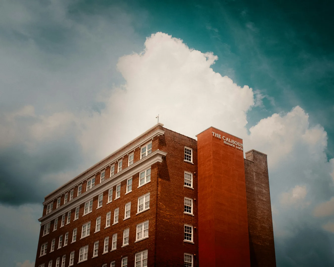 A tall brick building beneath a cloudy sky in Anderson South Carolina Scavenger Hunt