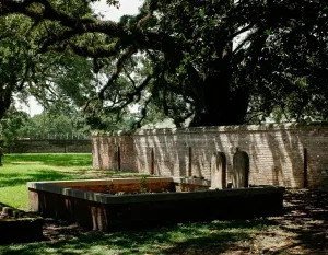 a stone wall with a bench in a park in Mobile Alabama Scavenger Hunt
